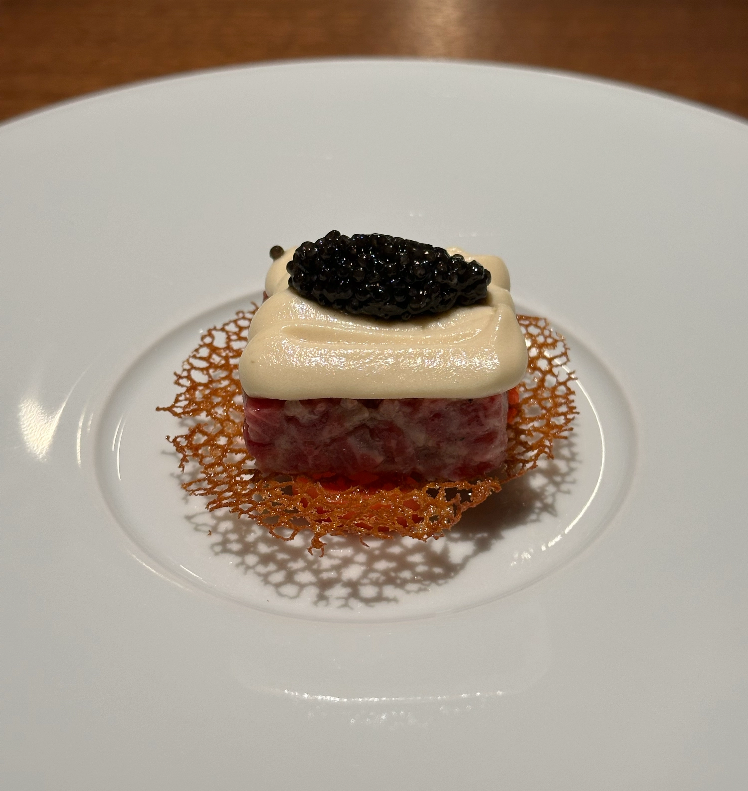 Beef tartar with potato puree and caviar. Collage, Seoul, South Korea.