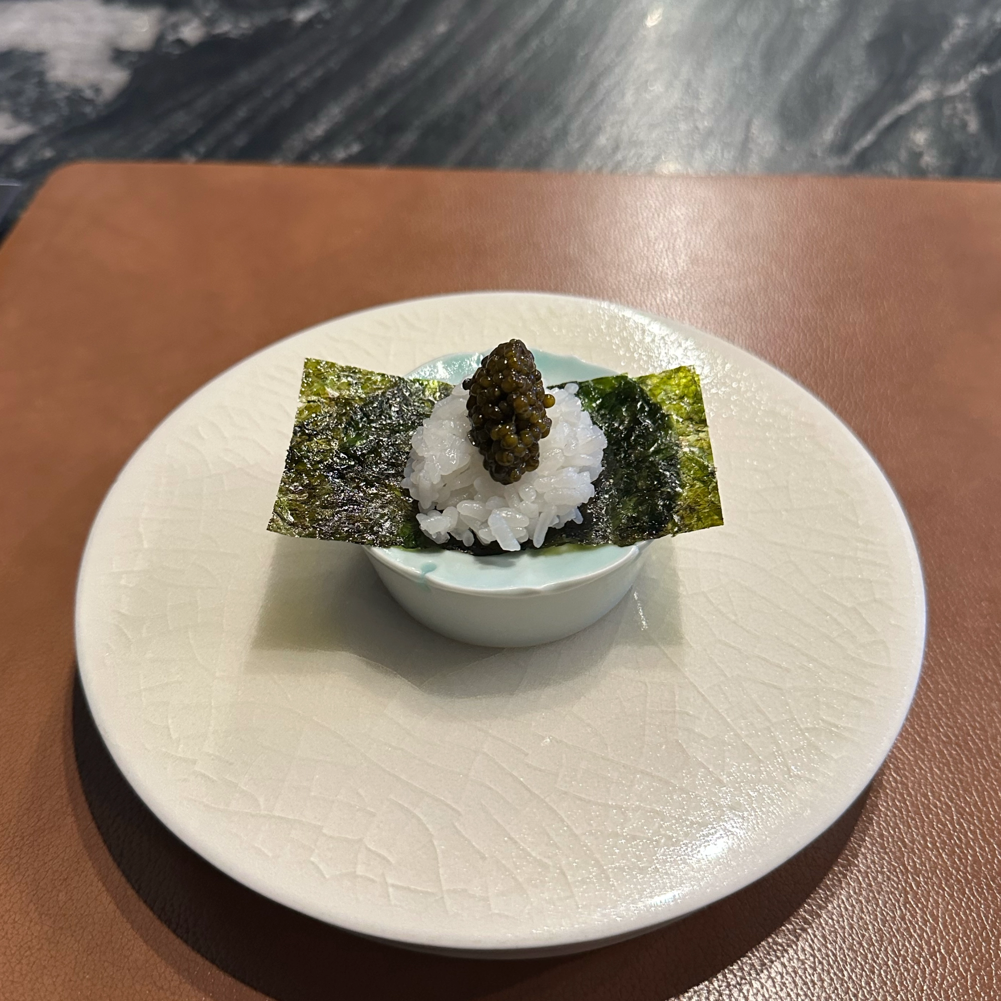 A signature dish of Seventh Door at Seoul, South Korea. Korean seaweed with rice, caviar for finish.
