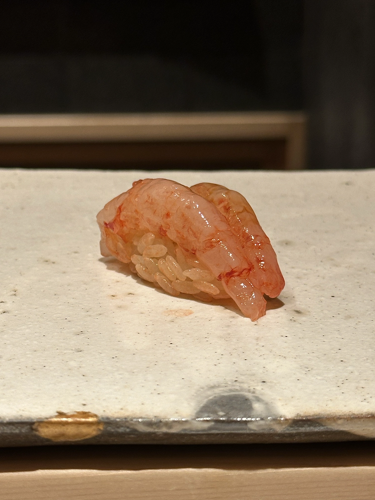 A piece of Ama-Ebi sushi of Sushi Ryujiro