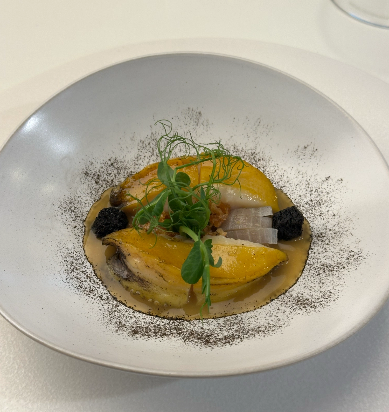 A signature dish of Trid, abalone and onion.