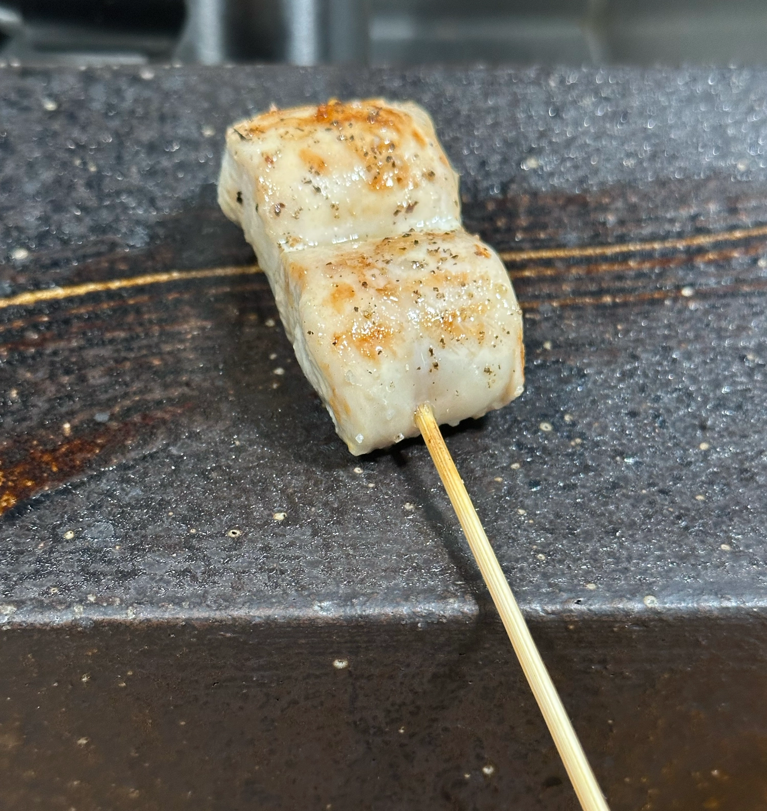 A Chicken breast skewer from Yakitori Kiyu, Seoul, South Korea.